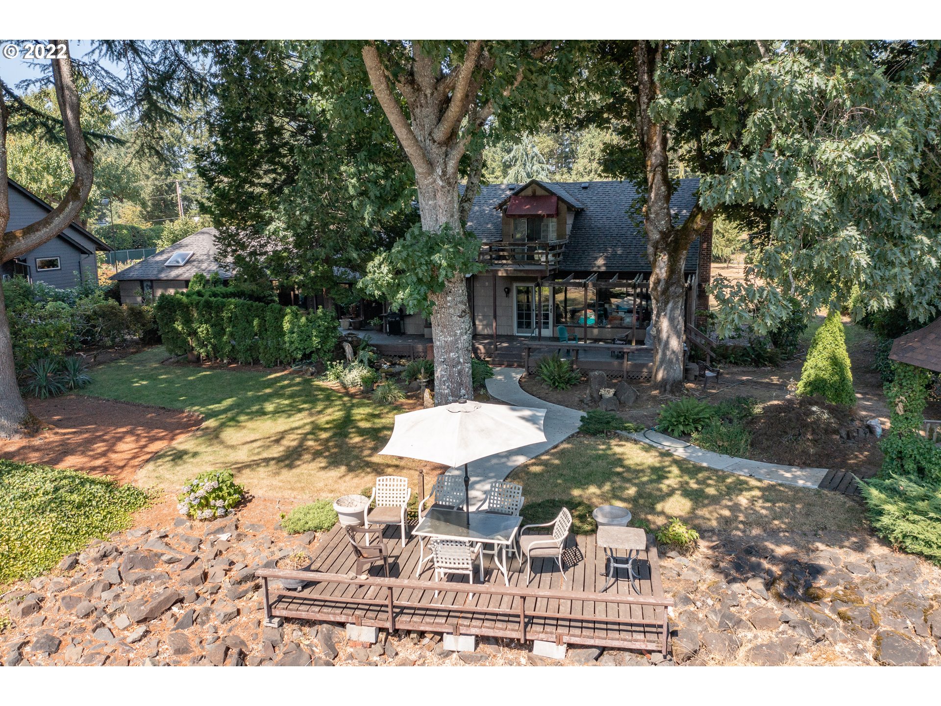 19460 Southeast Semple Road Damascus, OR 97089 - Photo 13 of 32 a view of a house with a yard and sitting area
