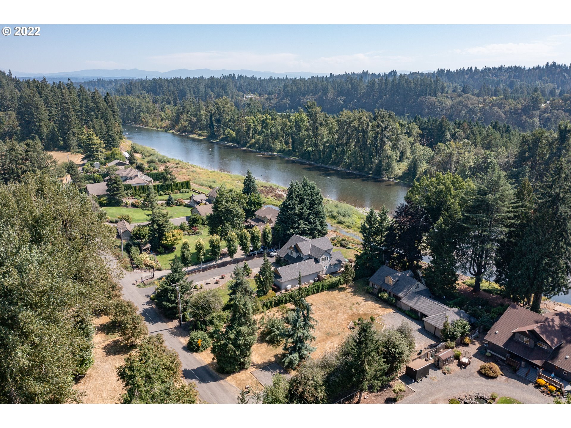 19460 Southeast Semple Road Damascus, OR 97089 - Photo 20 of 32 an aerial view of a house with a yard and lake view