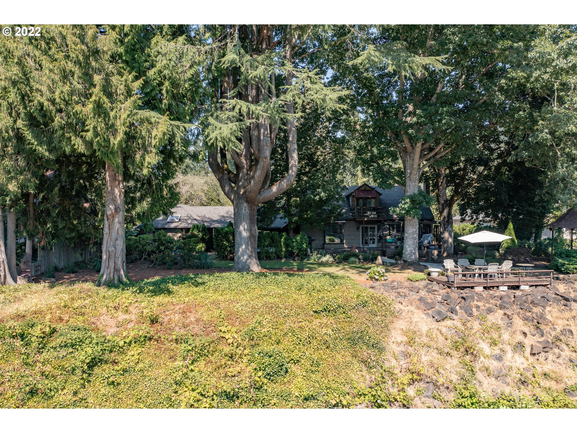 19460 Southeast Semple Road Damascus, OR 97089 - Photo 21 of 32 a backyard of a house with a tree