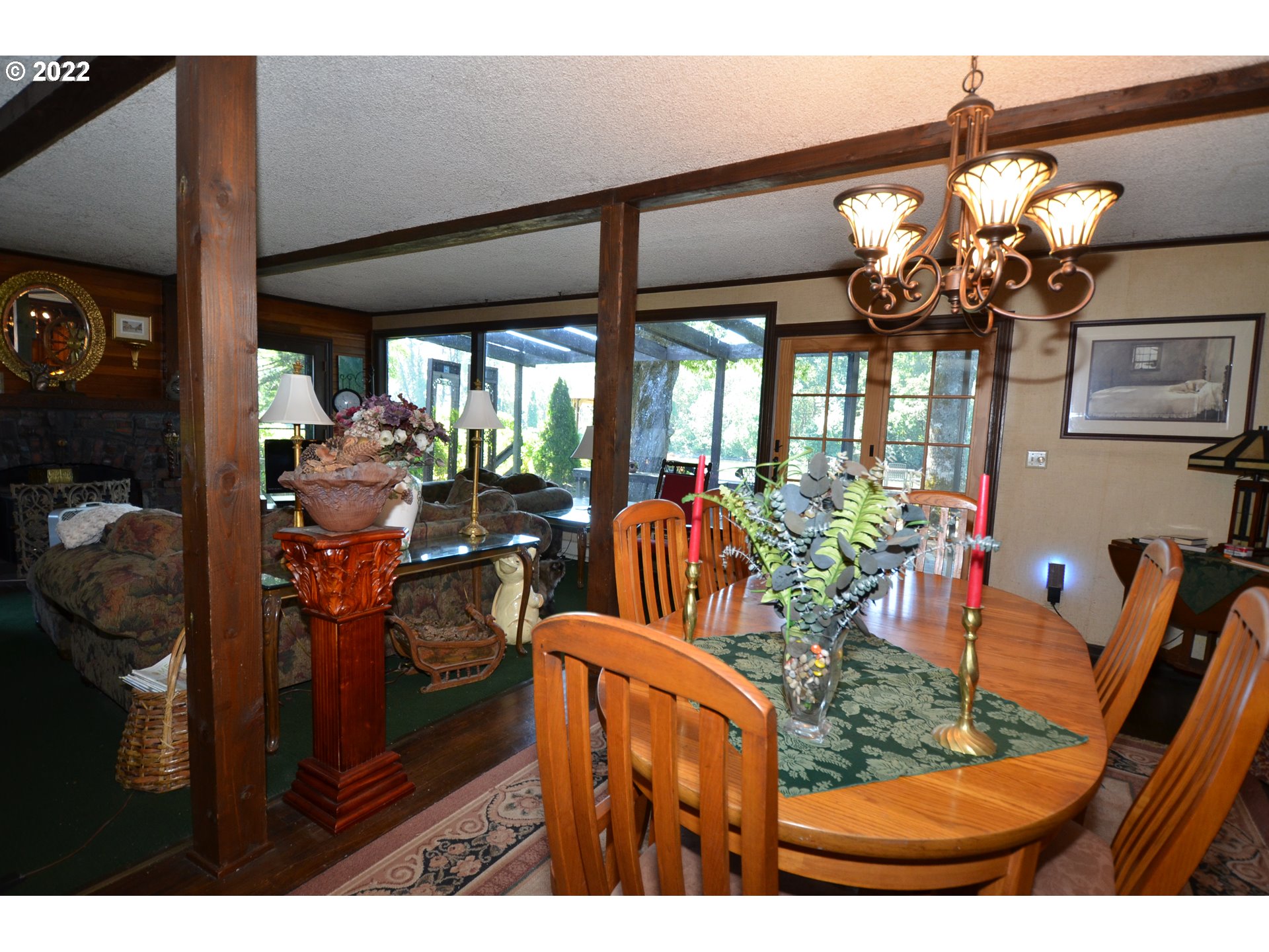 19460 Southeast Semple Road Damascus, OR 97089 - Photo 5 of 32 a view of a dining room with furniture a chandelier and large mirror
