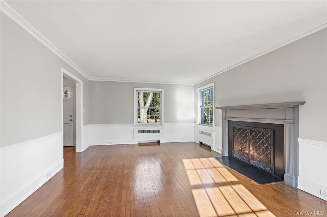 246 Mamaroneck Road Scarsdale, NY 10583 - Photo 4 of 35 Large living room with ornamental molding