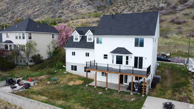 965 North 800 East Springville, UT 84663 - Photo 9 of 46 Rear view of house with a patio area, roof with shingles, a wooden deck, and a lawn