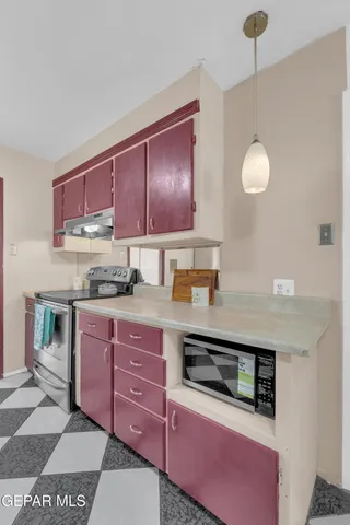 a bathroom with a sink mirror vanity and toilet