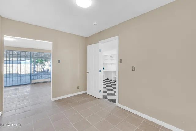 an empty room with a empty space and windows