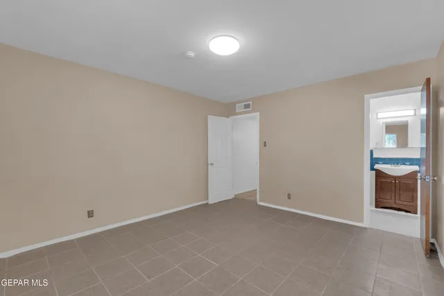 an aerial view of a houses with a city view