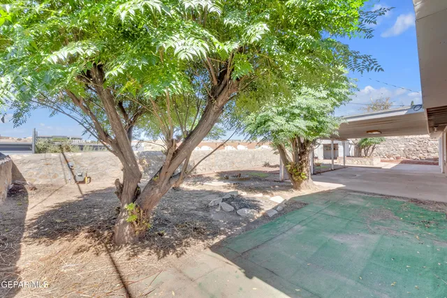 an aerial view of residential house and sandy dunes