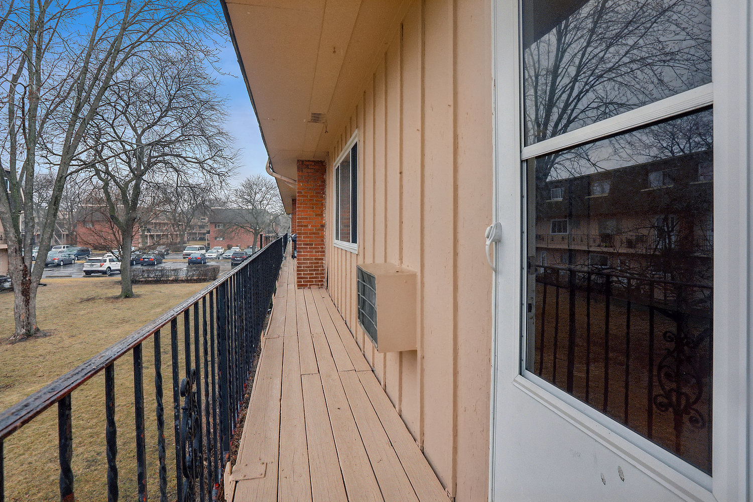 2312 West Algonquin Road, Unit 3 Rolling Meadows, IL 60008 - Photo 2 of 10 a view of a balcony with wooden floor