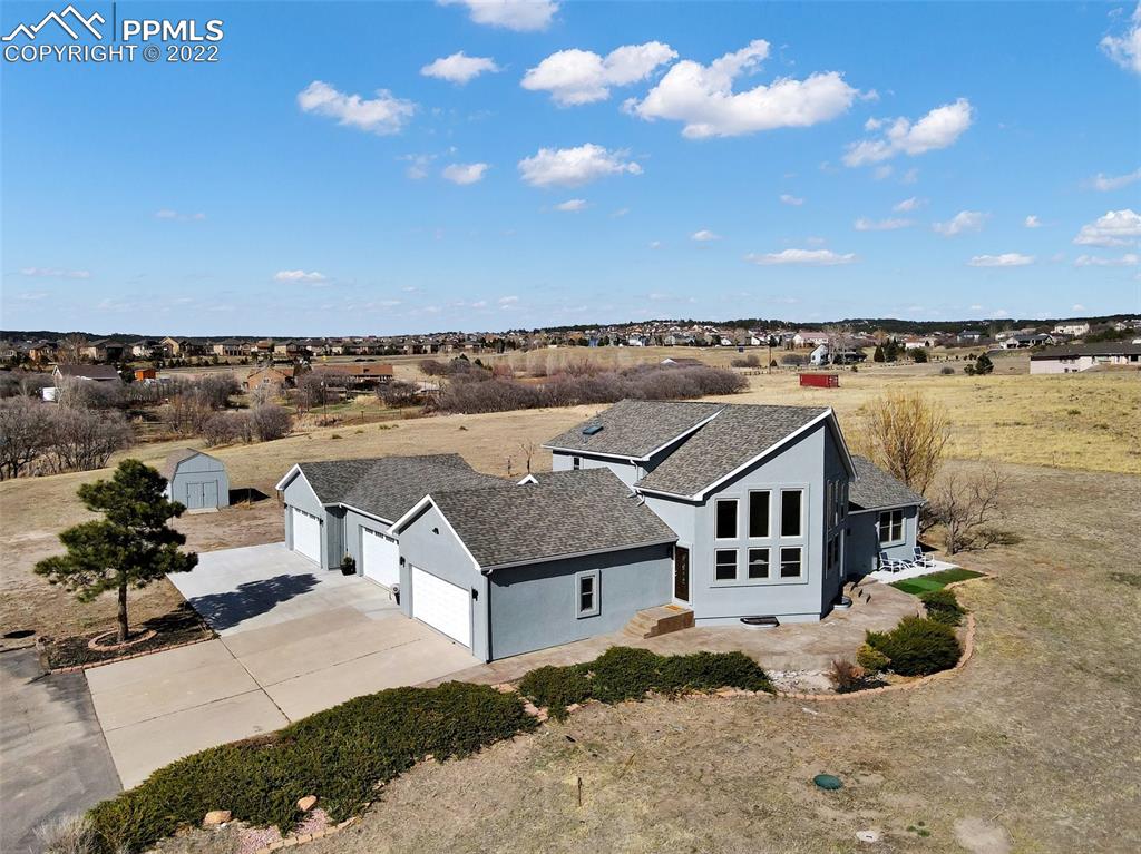 a aerial view of a house with a terrace