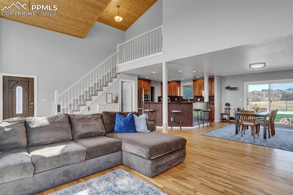 545 Struthers Loop Colorado Springs, CO 80921 - Photo 14 of 44 a living room with furniture and wooden floor