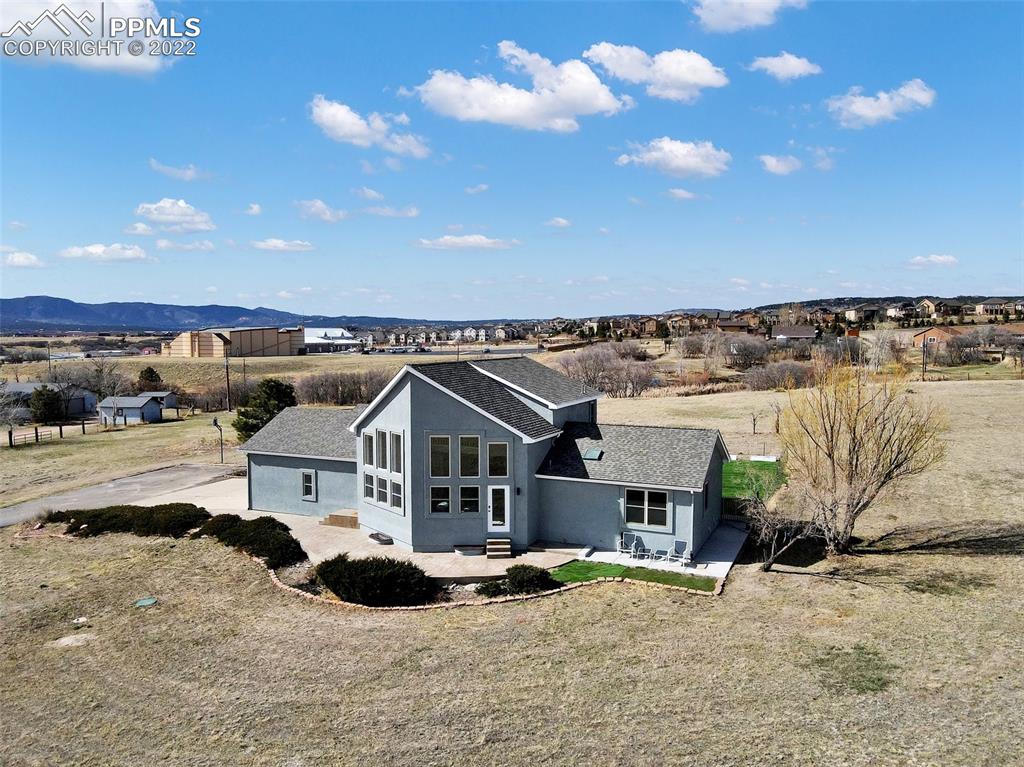 545 Struthers Loop Colorado Springs, CO 80921 - Photo 3 of 44 a view of a house with a terrace