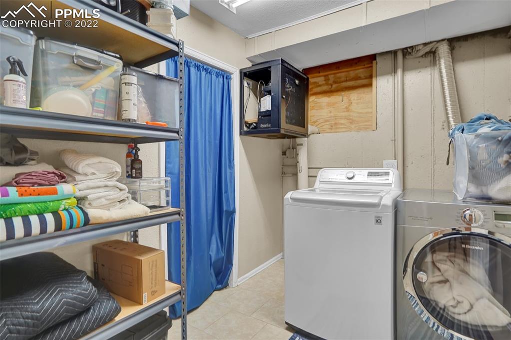 545 Struthers Loop Colorado Springs, CO 80921 - Photo 37 of 44 a utility room with dryer and washer