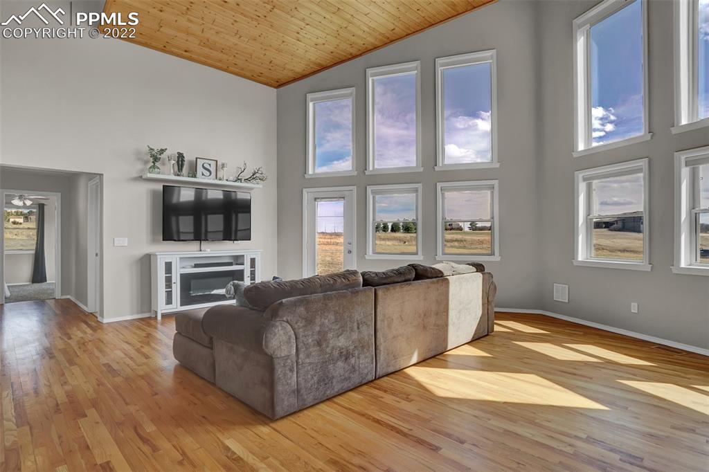 545 Struthers Loop Colorado Springs, CO 80921 - Photo 10 of 44 a living room with furniture and a flat screen tv