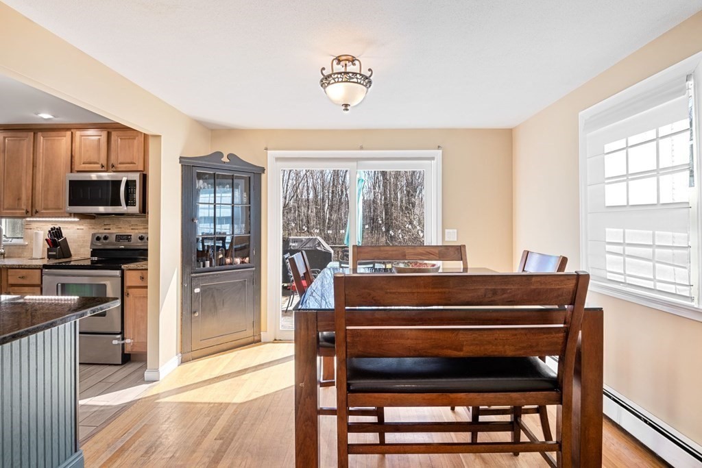 224 Oregon Road Ashland, MA 01721 - Photo 3 of 15 a view of kitchen with wooden floor and a dining table