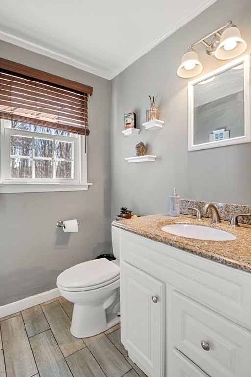 224 Oregon Road Ashland, MA 01721 - Photo 6 of 15 a bathroom with a granite countertop sink toilet and mirror