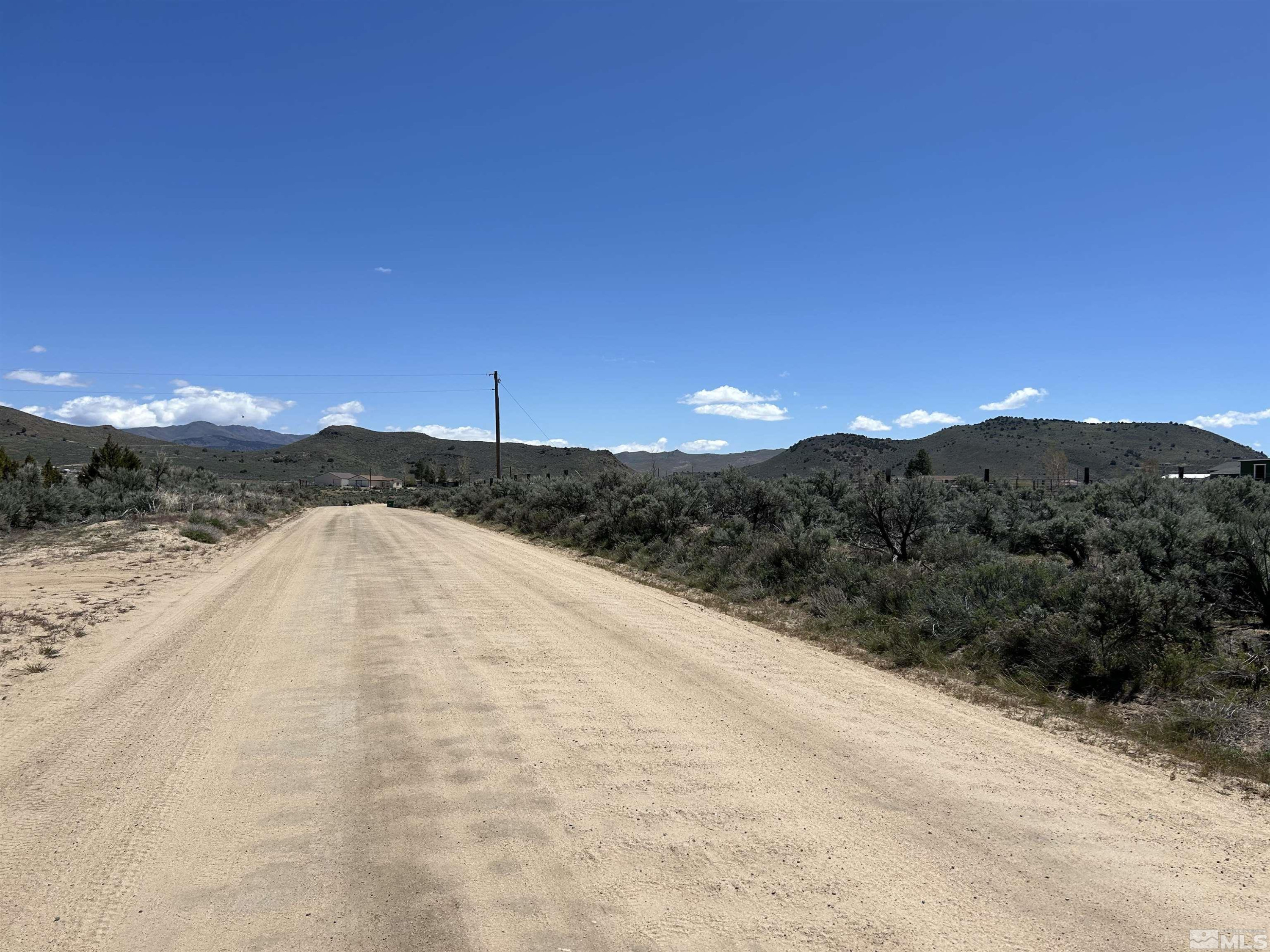 22905 Fetlock Drive Reno, NV 89508 - Photo 13 of 18 a view of a dry yard with wooden fence