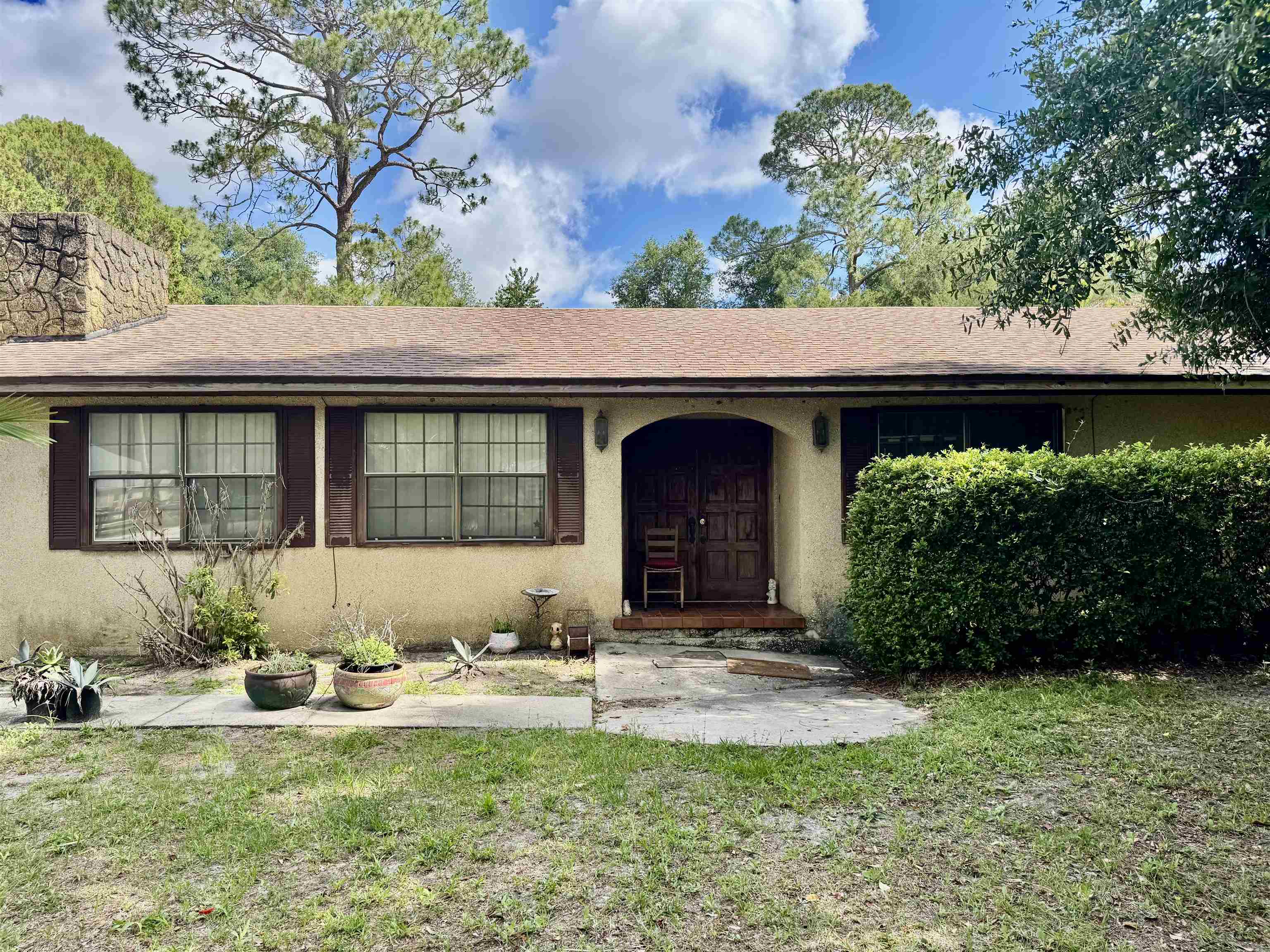 554 Hayley Road St. Augustine, FL 32086 - Photo 2 of 46 a view of a house with a yard and sitting area