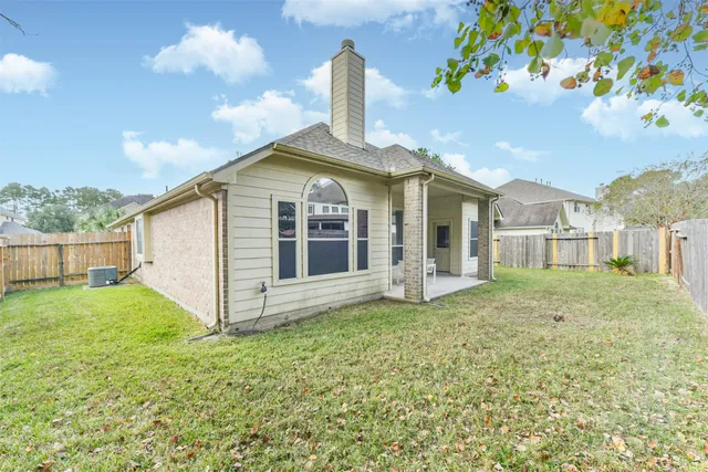 a house view with a backyard space