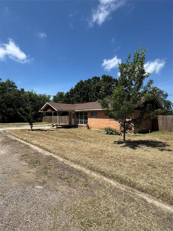 400 South Vick Street Decatur, TX 76234 - Photo 14 of 22 a view of a house with a yard