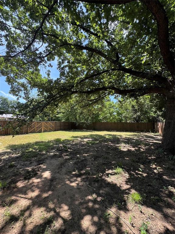 400 South Vick Street Decatur, TX 76234 - Photo 19 of 22 a view of a yard with an trees