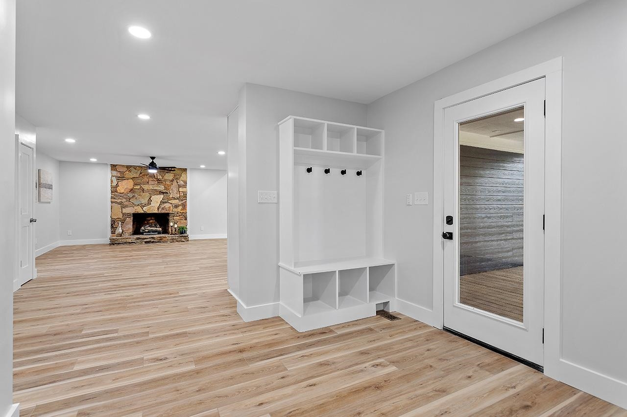 3420 East Garner Road Clayton, NC 27520 - Photo 16 of 30 an empty room with wooden floor and entrance