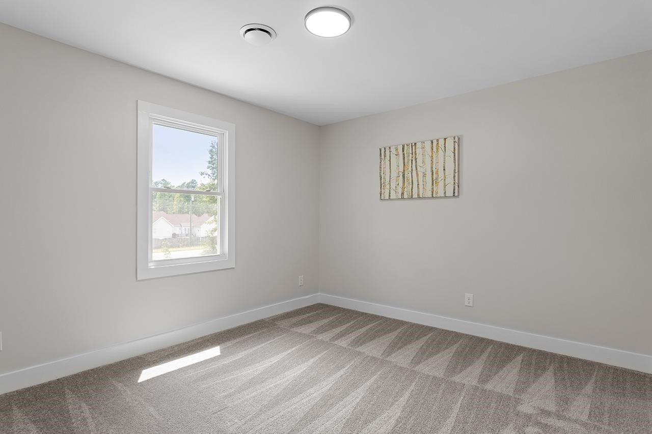3420 East Garner Road Clayton, NC 27520 - Photo 24 of 30 an empty room with a window