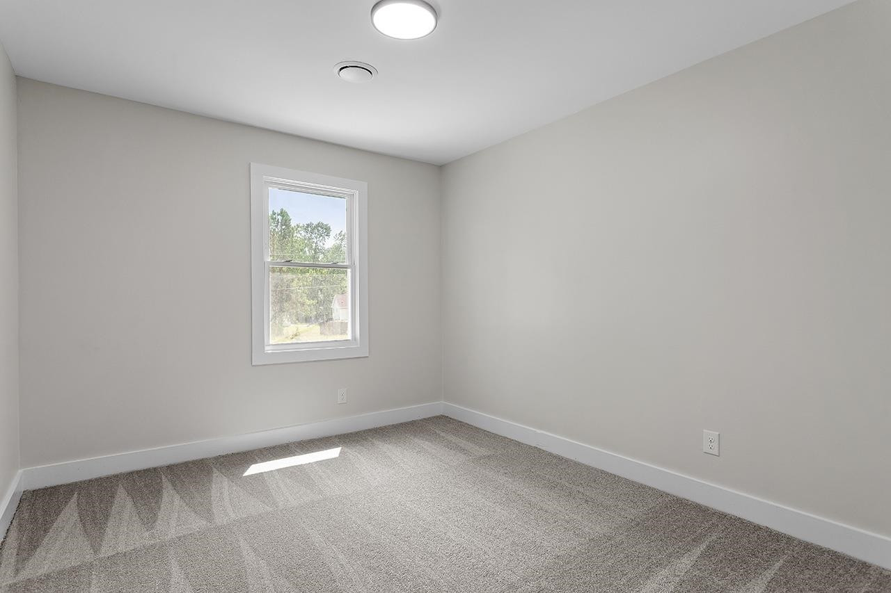3420 East Garner Road Clayton, NC 27520 - Photo 25 of 30 an empty room with a window