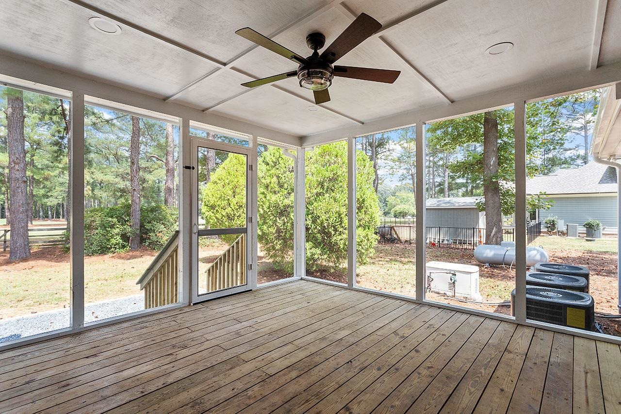 3420 East Garner Road Clayton, NC 27520 - Photo 28 of 30 a view of empty room with wooden floor and fan