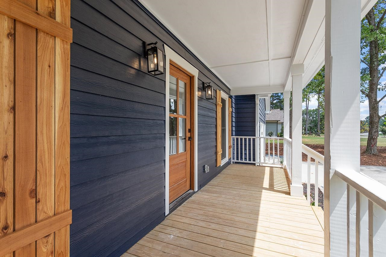 3420 East Garner Road Clayton, NC 27520 - Photo 3 of 30 a view of a balcony with wooden floor
