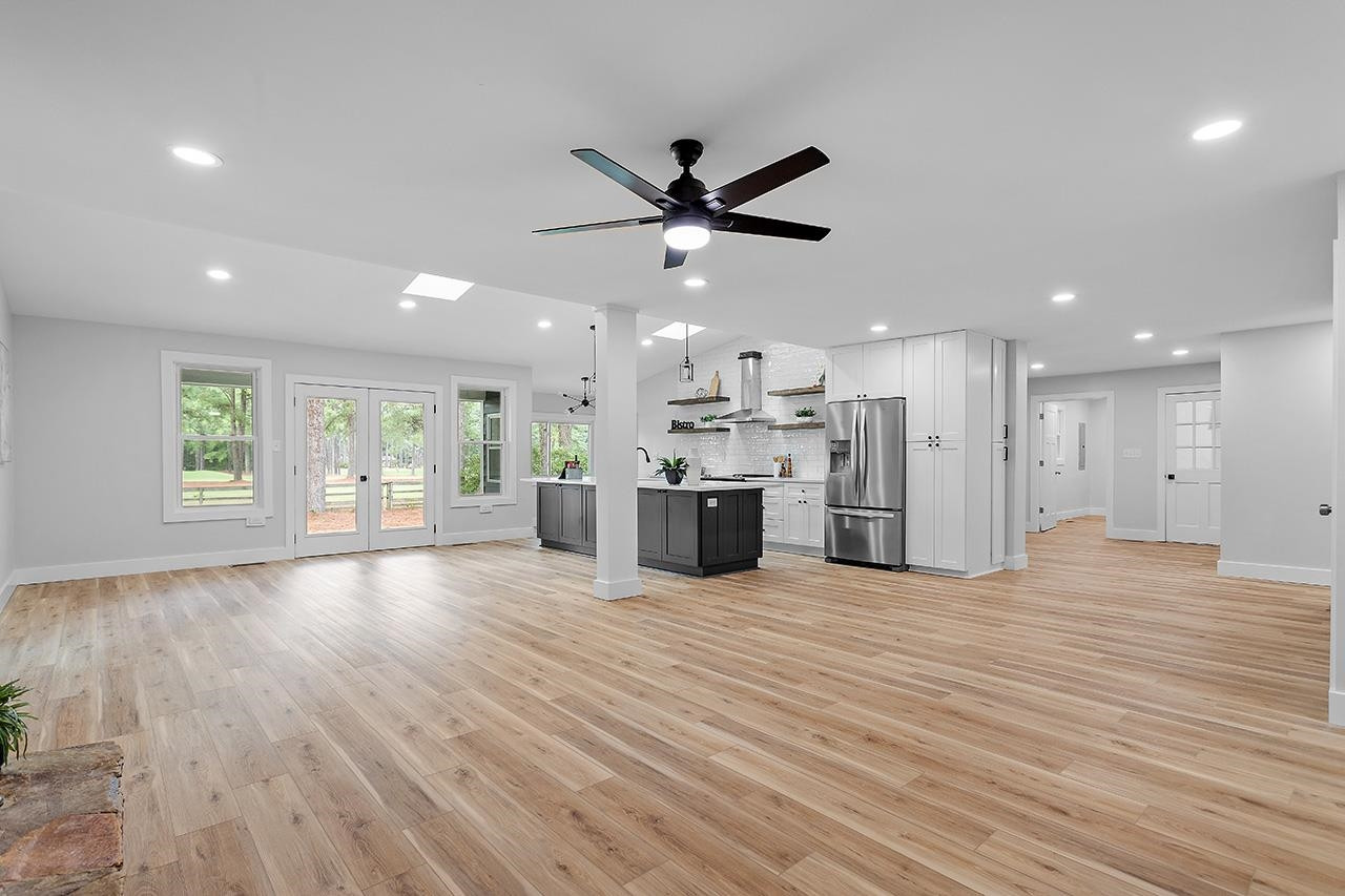 3420 East Garner Road Clayton, NC 27520 - Photo 9 of 30 a view of an empty room with kitchen appliances and a window
