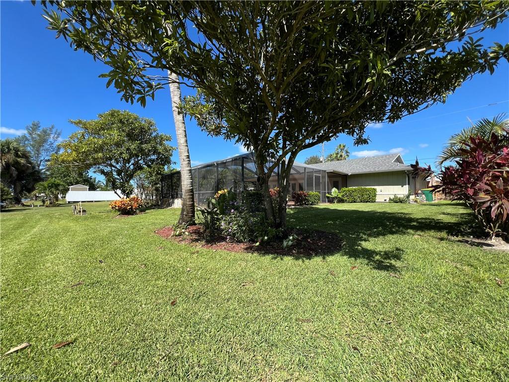 4724 32nd Avenue Southwest Naples, FL 34116 - Photo 11 of 39 a view of a garden with houses