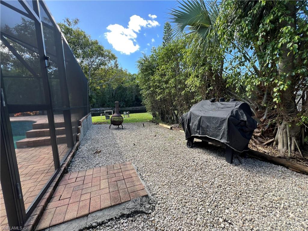 4724 32nd Avenue Southwest Naples, FL 34116 - Photo 16 of 39 a view of outdoor space with garden