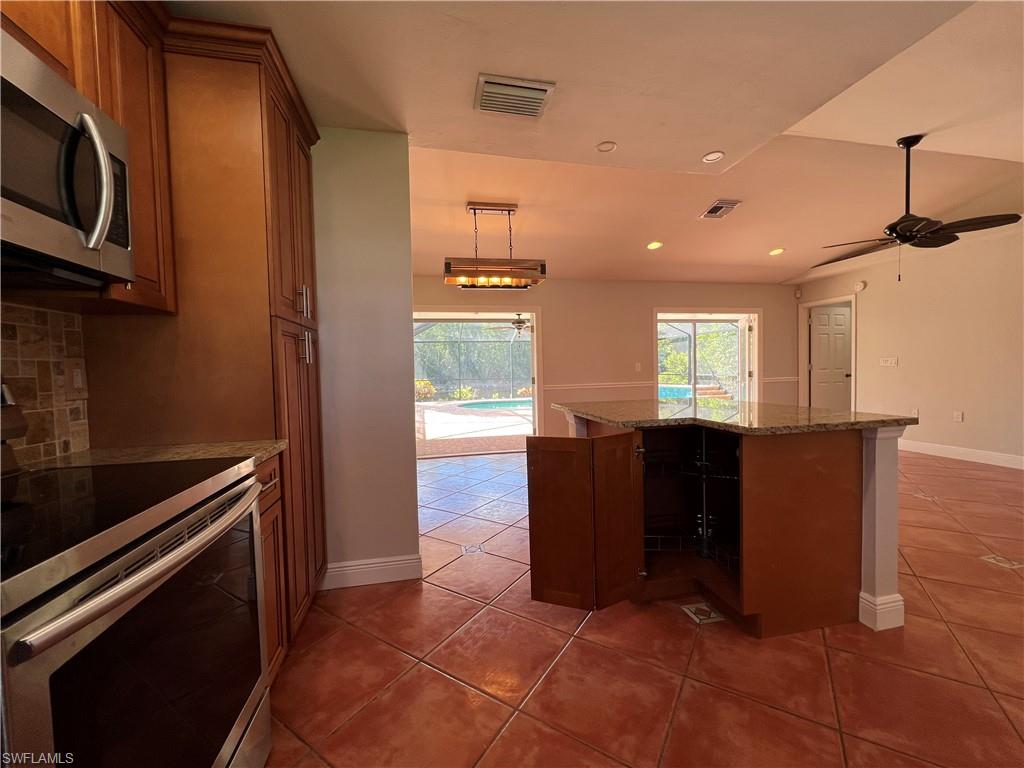4724 32nd Avenue Southwest Naples, FL 34116 - Photo 20 of 39 a view of kitchen and windows