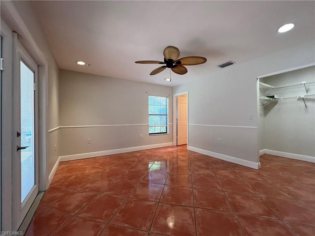 4724 32nd Avenue Southwest Naples, FL 34116 - Photo 24 of 39 a view of an empty room with a window