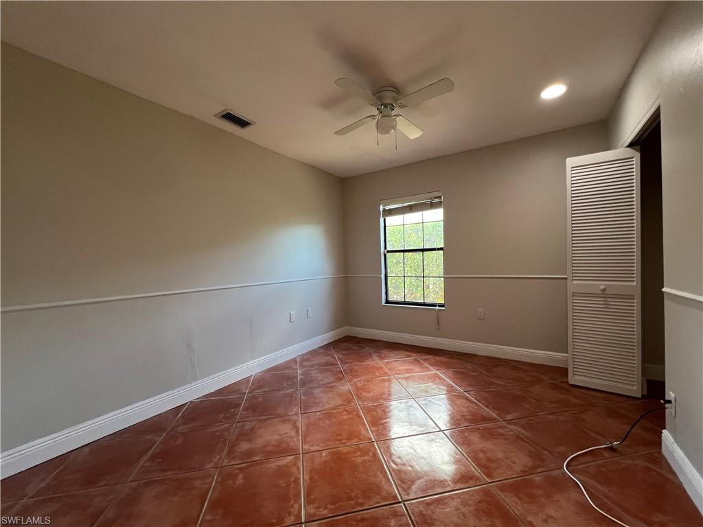 4724 32nd Avenue Southwest Naples, FL 34116 - Photo 31 of 39 a view of an empty room with a window