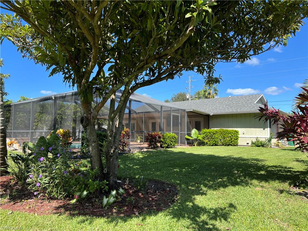 4724 32nd Avenue Southwest Naples, FL 34116 - Photo 39 of 39 a front view of a house with a garden