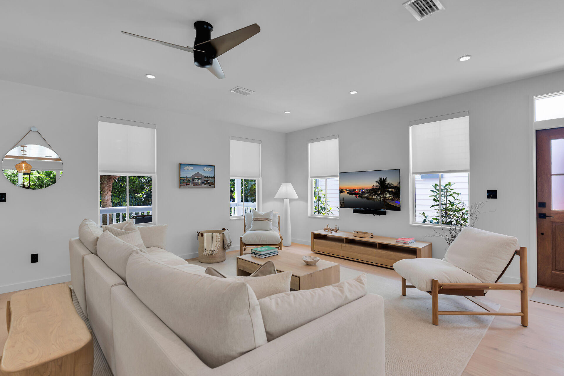 317 Whitehead Street Key West, FL 33040 - Photo 16 of 78 a living room with furniture and a flat screen tv