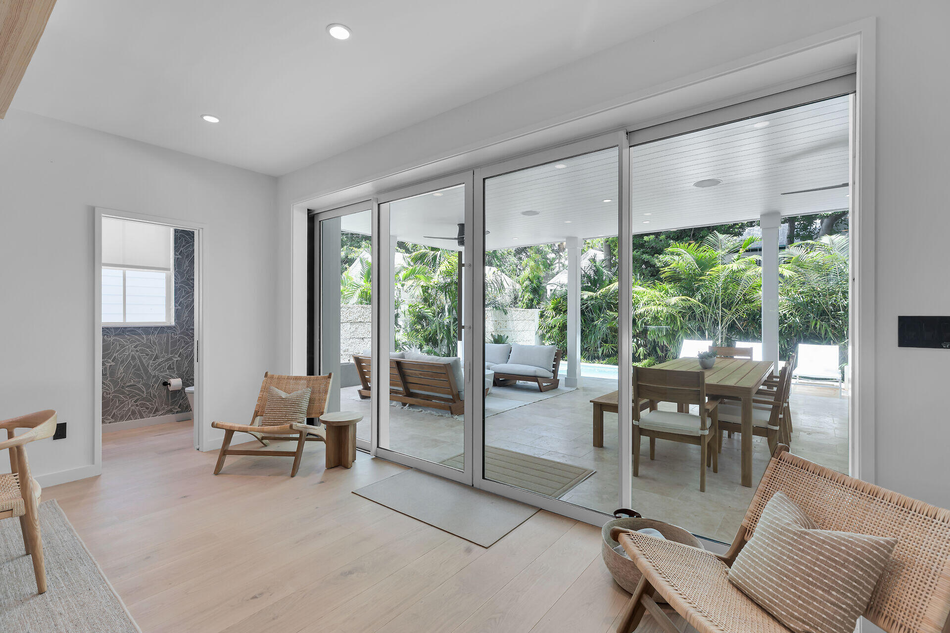 317 Whitehead Street Key West, FL 33040 - Photo 22 of 78 a dining room with furniture water view and a floor to ceiling window
