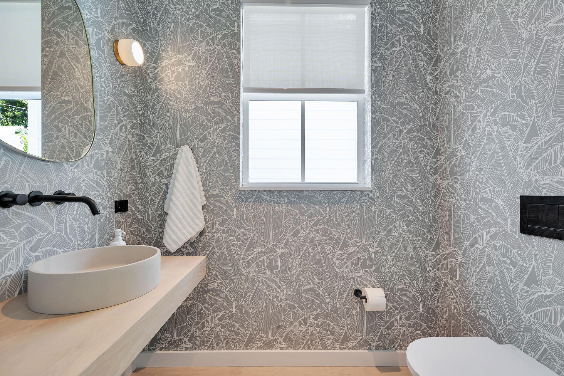 317 Whitehead Street Key West, FL 33040 - Photo 39 of 78 a bathroom with a toilet sink and mirror