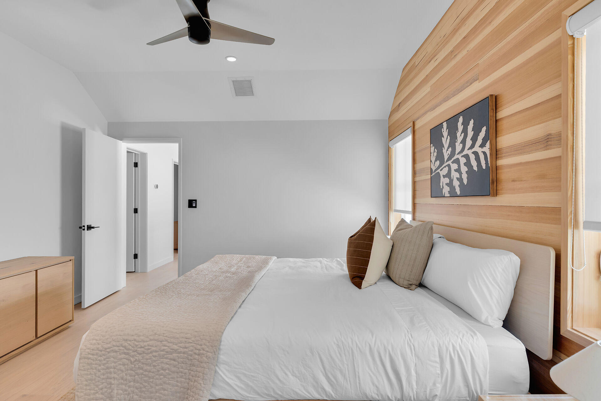 317 Whitehead Street Key West, FL 33040 - Photo 56 of 78 a bedroom with a bed and a painting on the wall