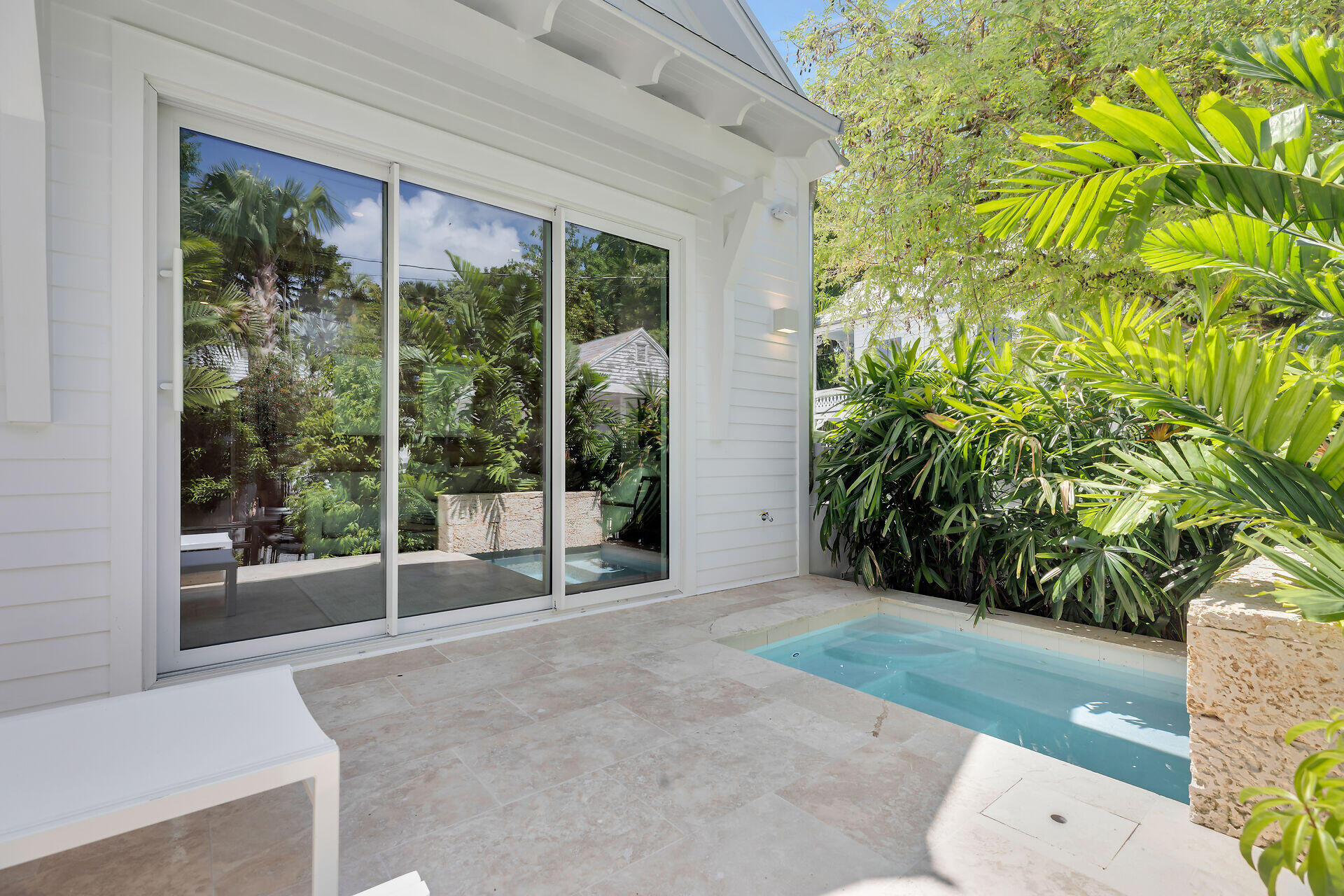317 Whitehead Street Key West, FL 33040 - Photo 61 of 78 a view of porch with a garden