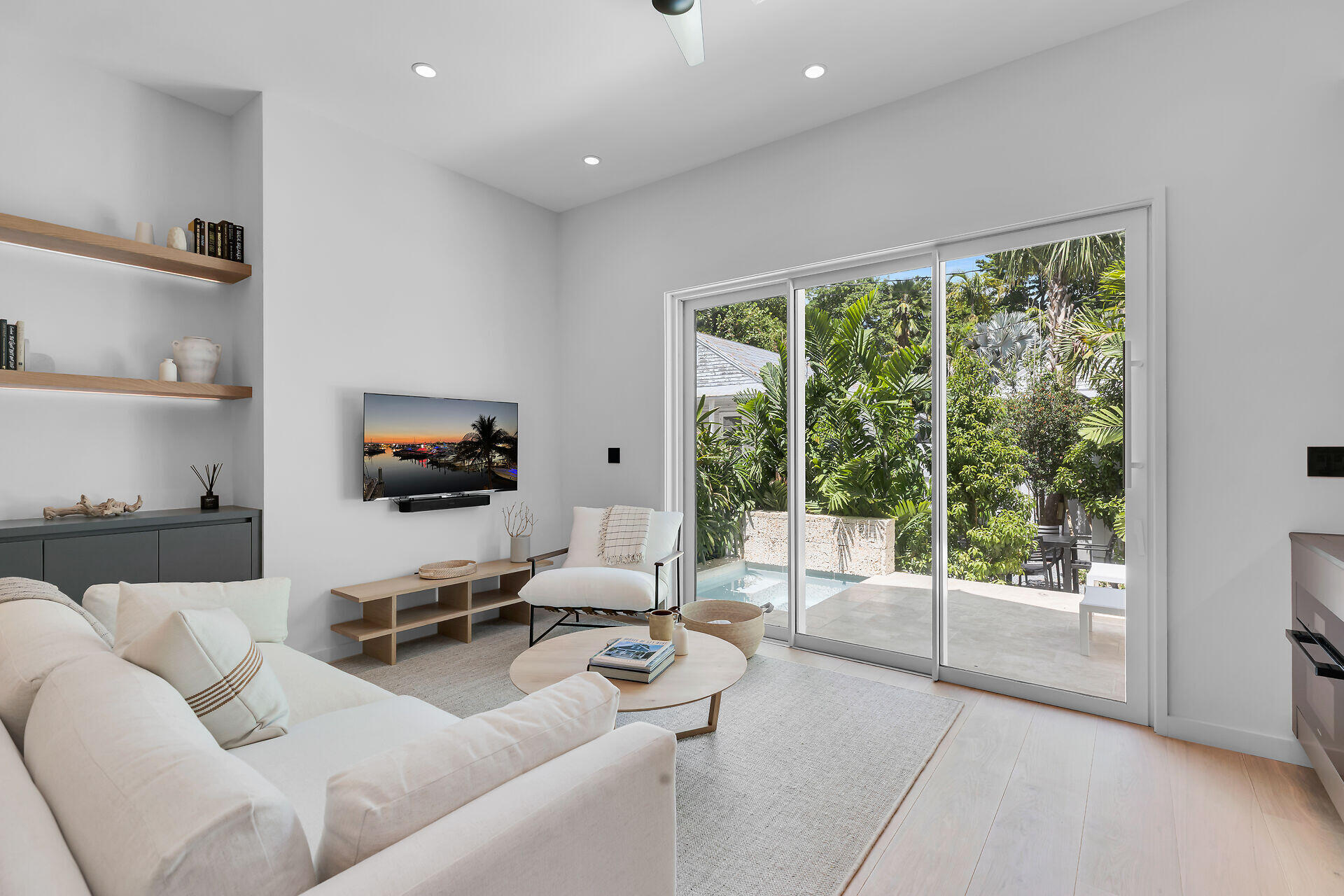 317 Whitehead Street Key West, FL 33040 - Photo 66 of 78 a living room with furniture and a flat screen tv