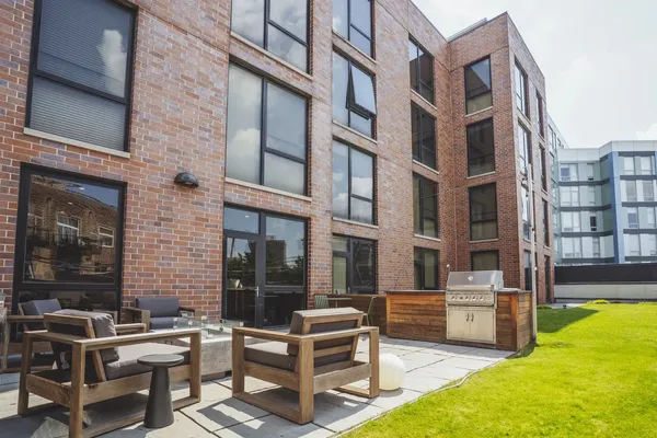 a view of a building with outdoor seating