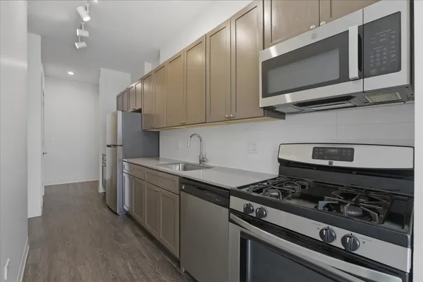 a kitchen with a stove and a microwave
