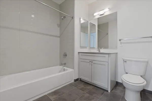 a bathroom with a sink a toilet and a bathtub
