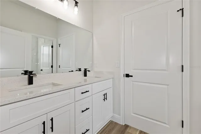 a bathroom with a bathtub and a sink