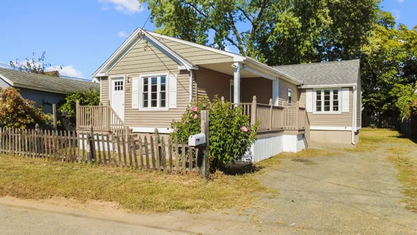 a front view of a house with a porch