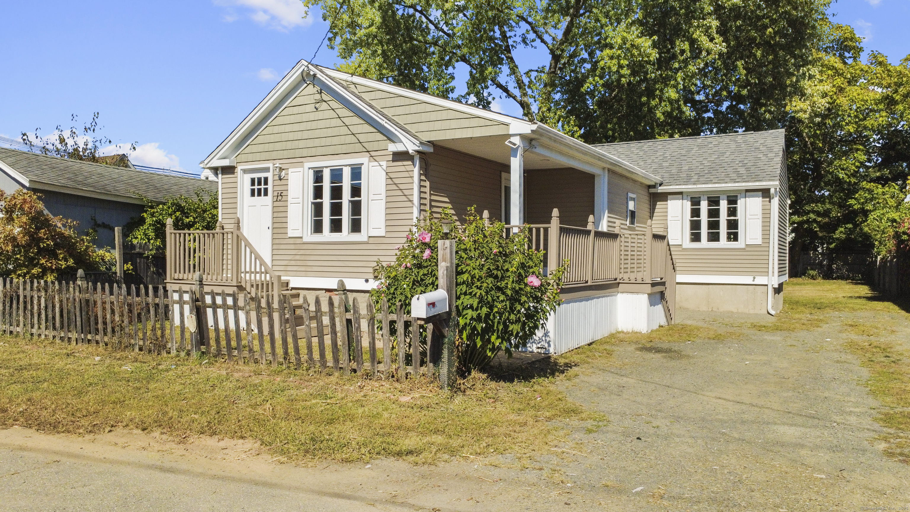 a front view of a house with a porch