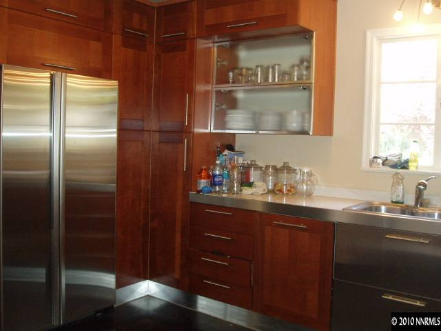 675 Manor Drive Reno, NV 89509 - Photo 3 of 9 a kitchen with a sink and a refrigerator