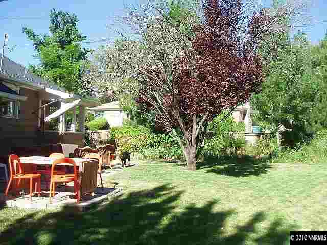 675 Manor Drive Reno, NV 89509 - Photo 7 of 9 a backyard of a house with table and chairs
