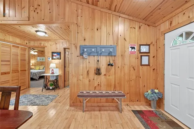 a view of dining room with wooden floor and furniture